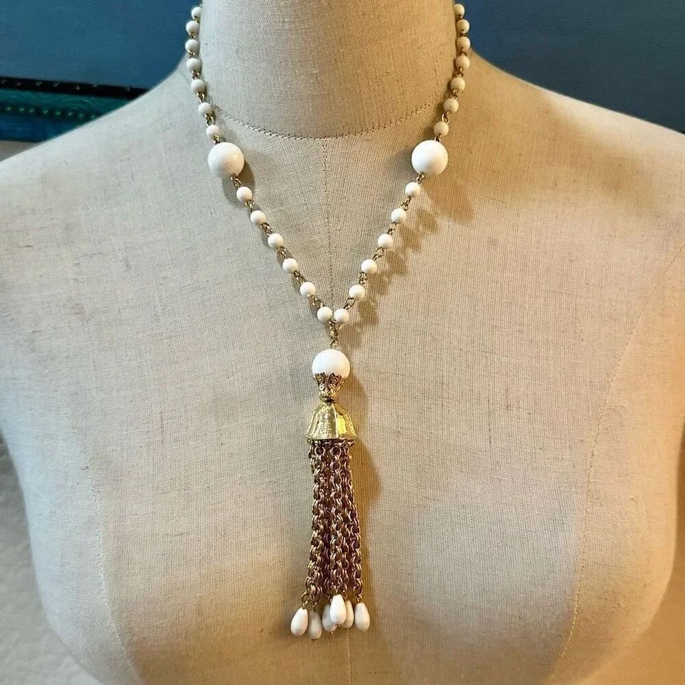 White beaded goldโtone vintage tassel necklace